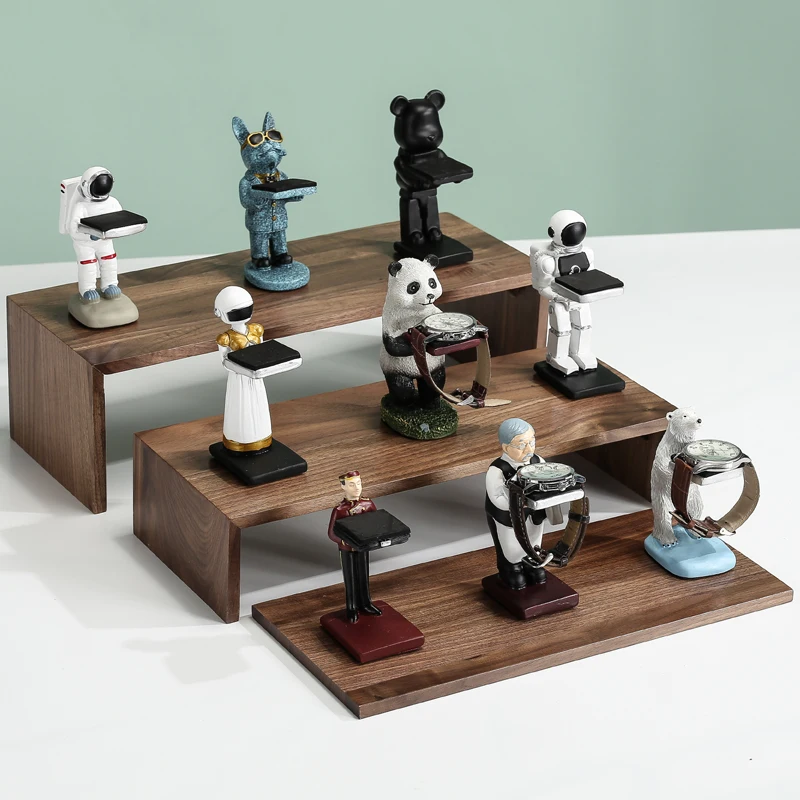 Creative astronaut watch stand displaying timepiece as desktop art piece