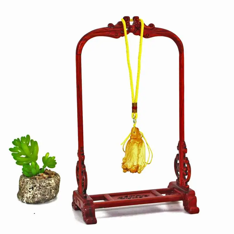Elegant wooden watch display stand for showcasing a prized timepiece